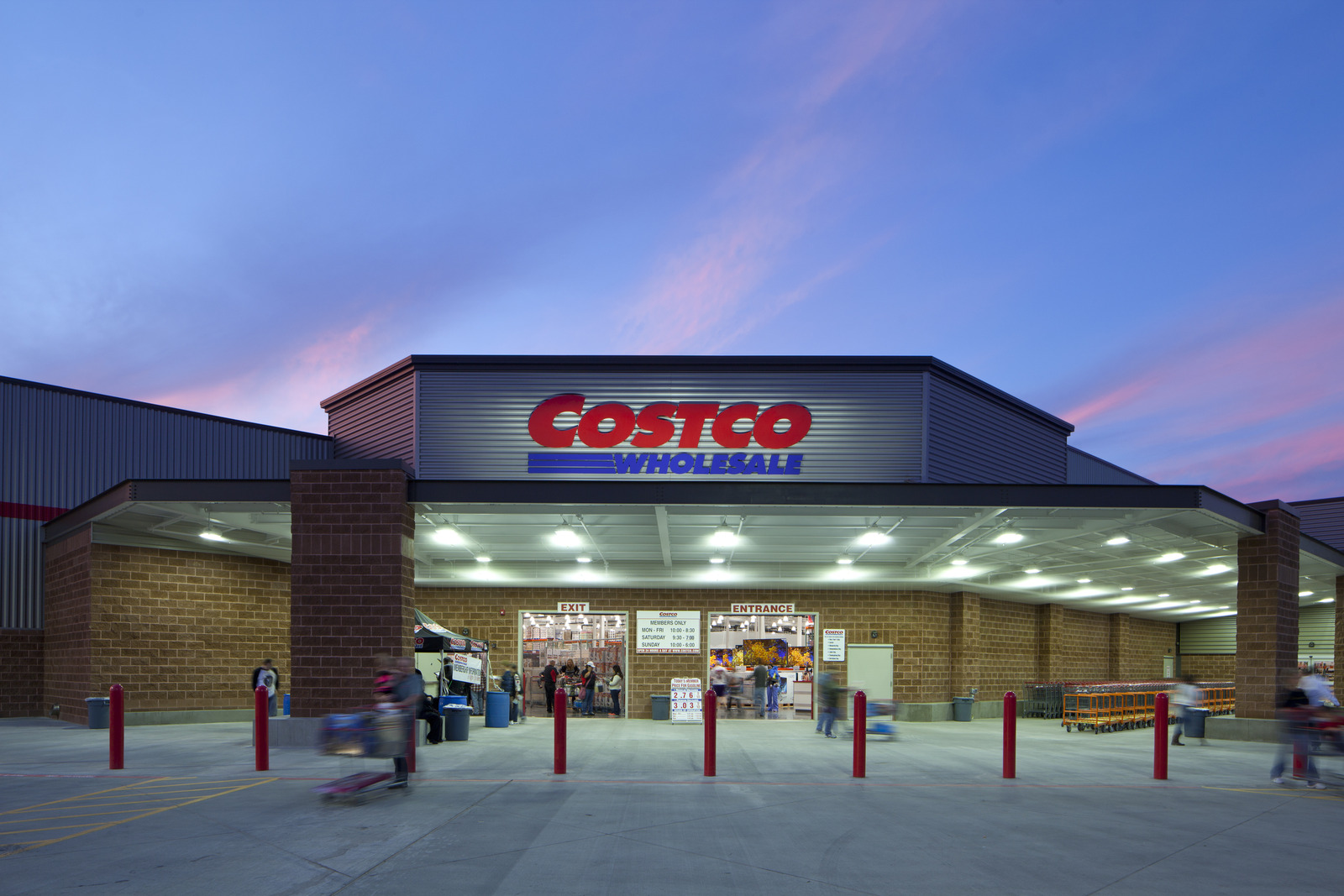 Costco Wholesale storefront at dusk