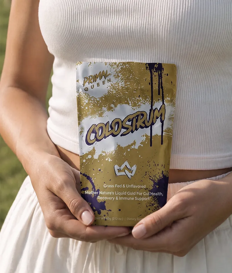 A Primal Queen Colostrum pouch held at the waist