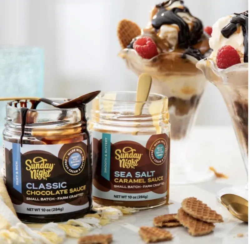 Sunday Night chocolate and sea salt caramel sauces beside ice cream sundaes
